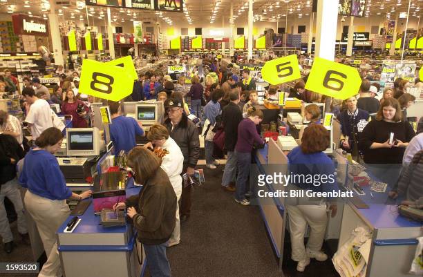 Shoppers kick off the holiday shopping season November 24 the busiest shopping day of the year known as Black Friday, at a Best Buy store in...