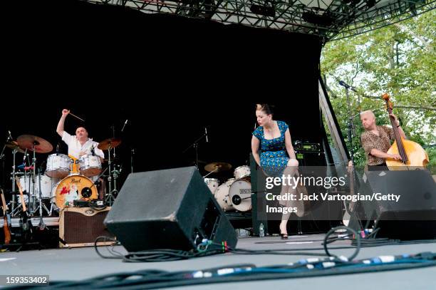 Irish musician Imelda May and her band, which includes Stephen Rushton on drums and Alan Gare on bass, perform on Central Park's SummerStage, New...