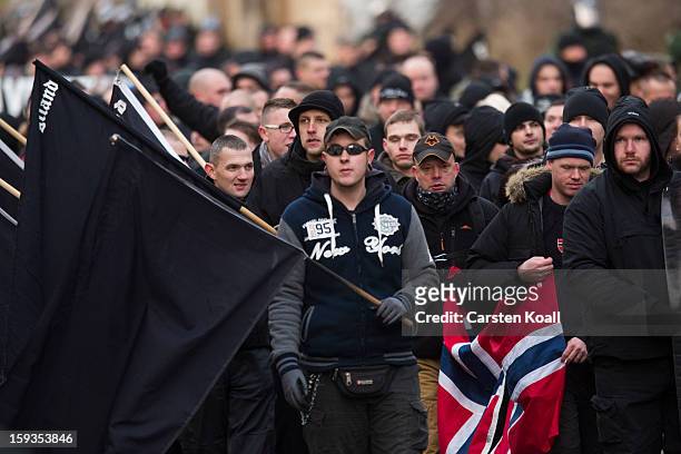 Neo-Nazis carry flags as they march during the commemoration of the 1945 Allied bombing of Magdeburg on January 12, 2013 in Magdeburg, Germany. The...