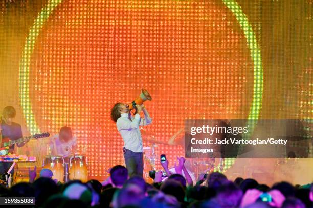 American rock musician Wayne Coyne and his bandmates in the Flaming Lips at a Benefit on Central Park's SummerStage, New York, New York, July 26,...