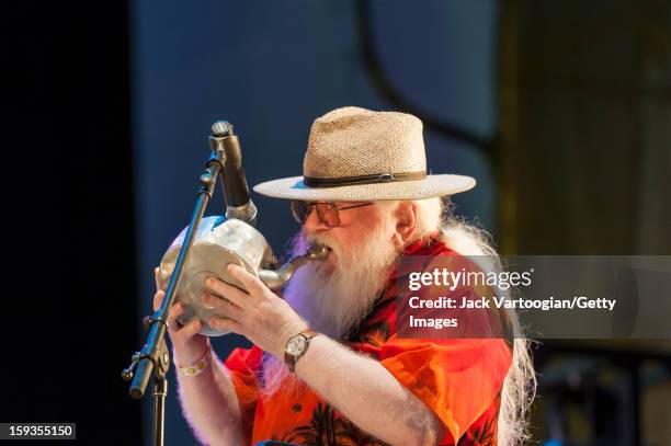 Brazilian composer and musician Hermeto Pascoal plays a copper tea pot at Lincoln Center's Damrosch Park Bandshell, New York, New York, August 6,...