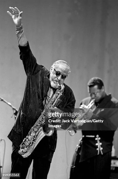 American musician Sonny Rollins plays tenor saxophone as he leads his sextet at the Beacon Theater, New York, New York, November 18, 1995. Also...