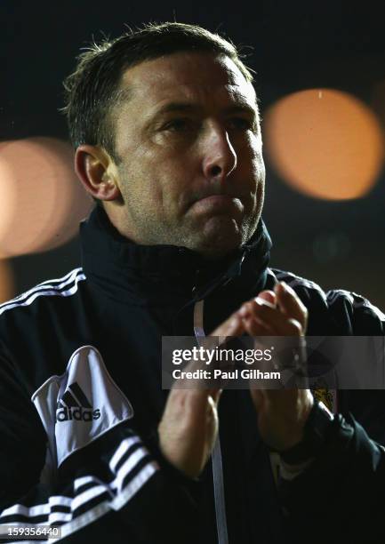 Manager Derek McInnes of Bristol City applauds the fans as he leaves the pitch at the end of the 4-0 defeat to Leicester City during the npower...