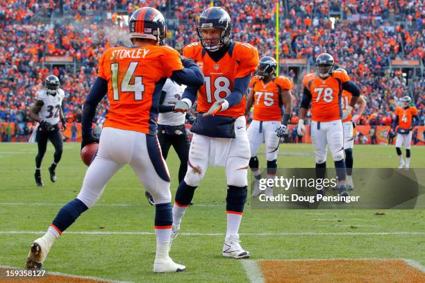 Peyton Manning oand Brandon Stokley of the Denver Broncos celebrate after Stokley caught a 15-yard toucdown reception in from Manning in the first...