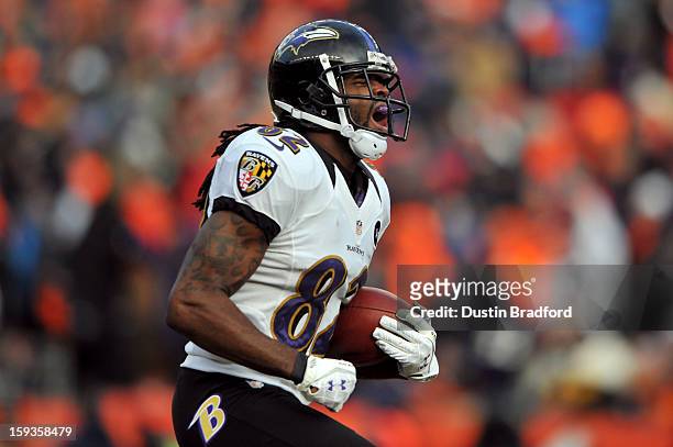 Torrey Smith of the Baltimore Ravens reacts after he scored a 59-yard touchdown reception in the first quarter against the Denver Broncos during the...