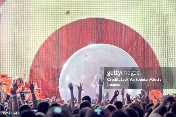 American rock musician Wayne Coyne, of the band the Flaming Lips, performs from inside a bubble at a Benefit on Central Park's SummerStage, New York,...