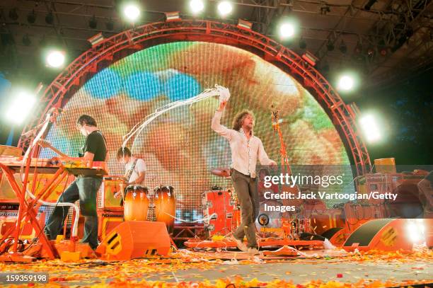 American rock musician Wayne Coyne and his bandmates in the Flaming Lips at a Benefit on Central Park's SummerStage, New York, New York, July 26,...