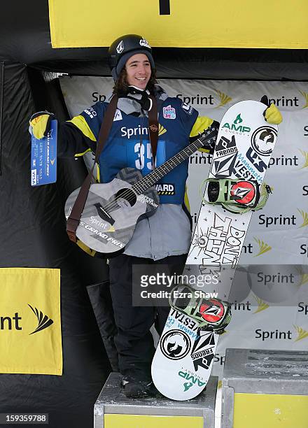 Luke Mitrani stands on the podium after placing second in the FIS Snowboard World Cup Half Pipe men's finals at the US Grand Prix on January 12, 2013...