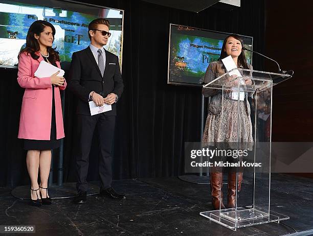 Producer Mynette Louie receives the Piaget Producers Award from actress Salma Hayek and actor Jeremy Renner at the 2013 Film Independent Filmmaker...