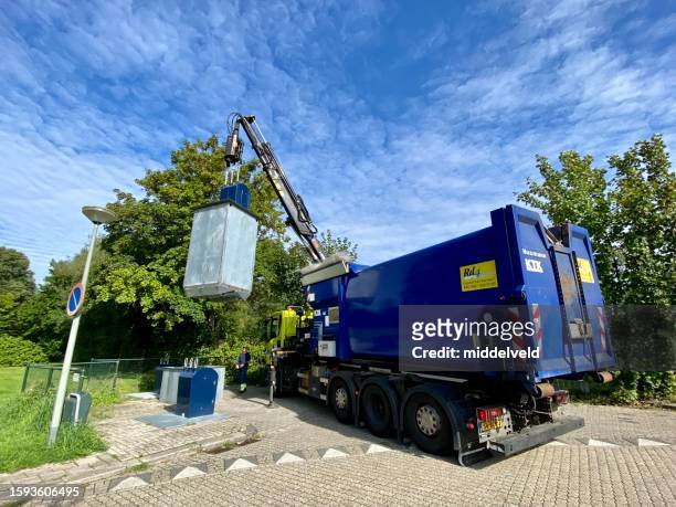 waste paper collector in the city - dustbin lorry stock pictures, royalty-free photos & images