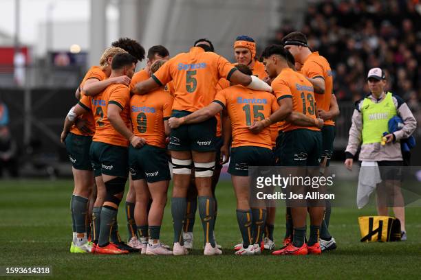 Australia forms a huddle during The Rugby Championship & Bledisloe Cup match between the New Zealand All Blacks and the Australia Wallabies at...