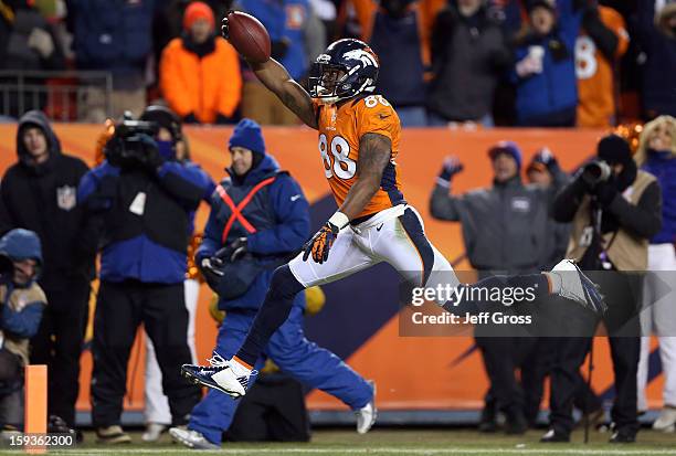 Demaryius Thomas of the Denver Broncos scores a 17-yard touchdown reception in the fourth quarter against the Baltimore Ravens during the AFC...