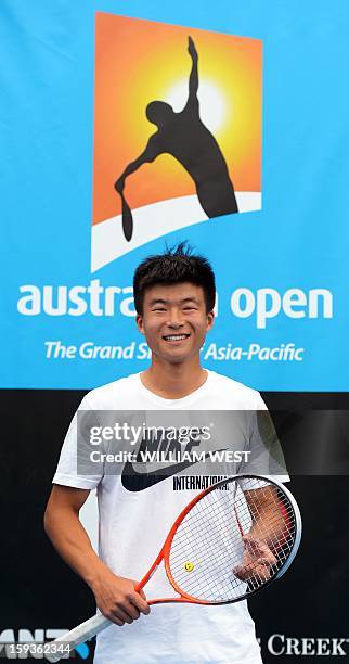 Wu Di of China attends a training session ahead of the Australian Open tennis tournament in Melbourne on January 13, 2013. AFP PHOTO / WILLIAM WEST...