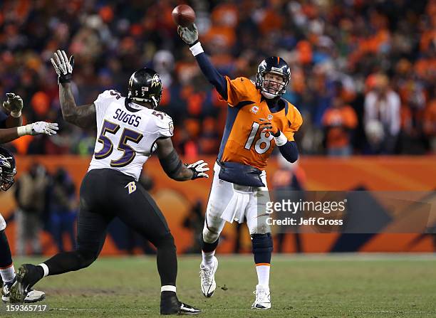 Peyton Manning of the Denver Broncos throws a pass in in the fourth quarter against Terrell Suggs of the Baltimore Ravens during the AFC Divisional...