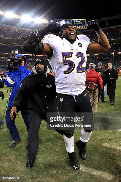 Ray Lewis of the Baltimore Ravens celebrates as he walks off of the field after the Ravens won 38-35 in the second overtime against the Denver...
