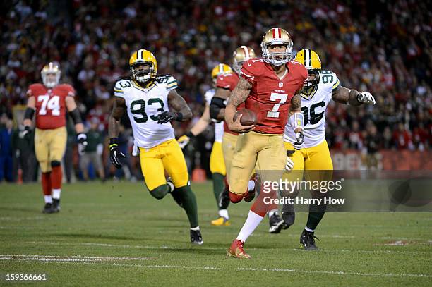Quarterback Colin Kaepernick of the San Francisco 49ers runs for a touchdown in the first quarter against the Green Bay Packers during the NFC...