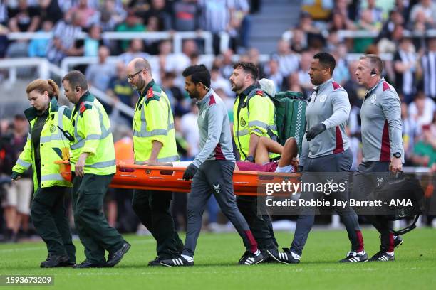 Tyrone Mings of Aston Villa goes off on a stretcher during the Premier League match between Newcastle United and Aston Villa at St. James Park on...