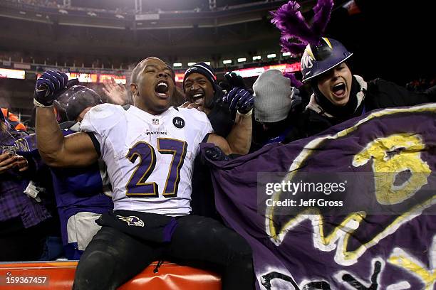 Ray Rice of the Baltimore Ravens celebrates with fans in the stands after the Ravens won 38-35 in the second overtime against the Denver Broncos...