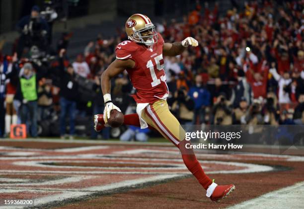 Wide receiver Michael Crabtree of the San Francisco 49ers runs the ball in for a touchdown thrown by quarterback Colin Kaepernick in the second...