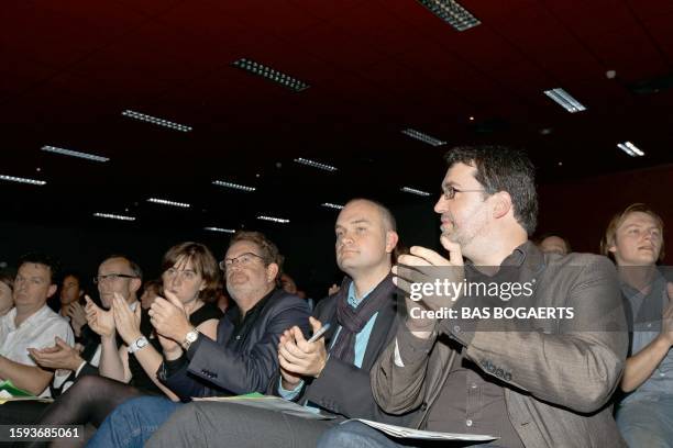 Belgian Green party Chairman Wouter Van Besien and Vice Chairman Bjorn Rzoska applaud on October 9, 2010 after both being re-elected at a party...
