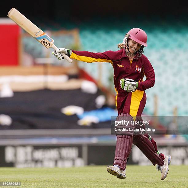 Jodie Fields celebrates on scoring a century during the WNCL Final match between the NSW Breakers and the Queensland Fire at the Sydney Cricket...