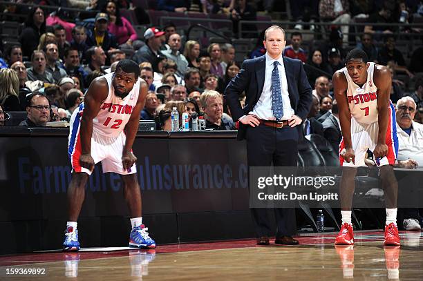 Will Bynum , Head Coach Lawrence Frank and Brandon Knight of the Detroit Pistons look to their teammates on the court against the Utah Jazz during...