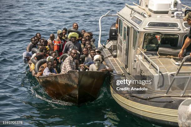 Irregular migrants are seen on the boat as an operation is carried out by the Tunisian National Guard against the migrants who want to reach Europe...