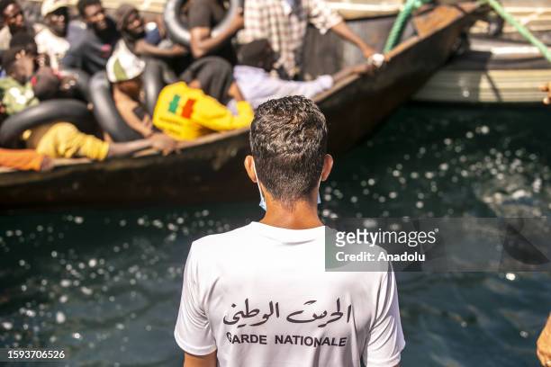 Irregular migrants are seen on the boat as an operation is carried out by the Tunisian National Guard against the migrants who want to reach Europe...