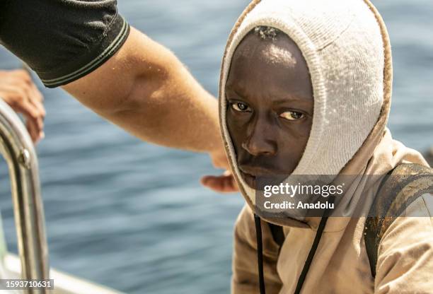 Migrant is seen on the boat as an operation is carried out by the Tunisian National Guard against the migrants who want to reach Europe illegally via...