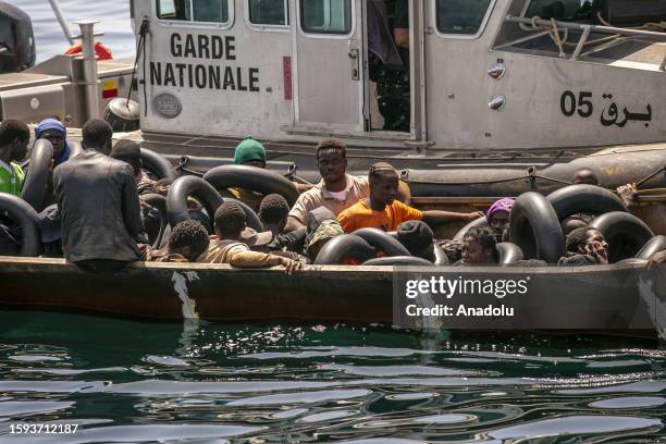 Irregular migrants are seen on the boat as an operation is carried out by the Tunisian National Guard against the migrants who want to reach Europe...