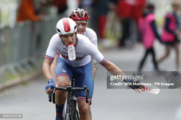 Great Britain's Stephen Bate with pilot Christopher Latham in action in the Men's B Road Race during day nine of the 2023 UCI Cycling World...