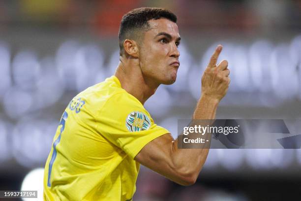 Nassr's Portuguese forward Cristiano Ronaldo celebrates scoring his team's first goal during the 2023 Arab Club Champions Cup final football match...