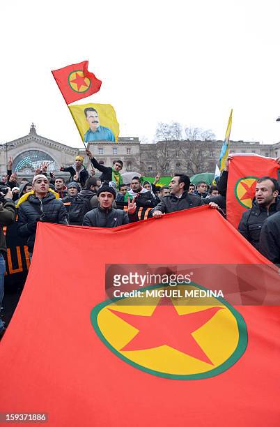 People of Kurdish origin hold a flag Hundreds of people of Kurdish origin take part in a demonstration on January 12, 2013 in Paris, two days after...