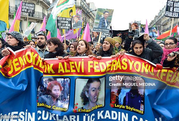 Hundreds of people of Kurdish origin take part in a demonstration on January 12, 2013 in Paris, two days after three Kurdish women were found shot...