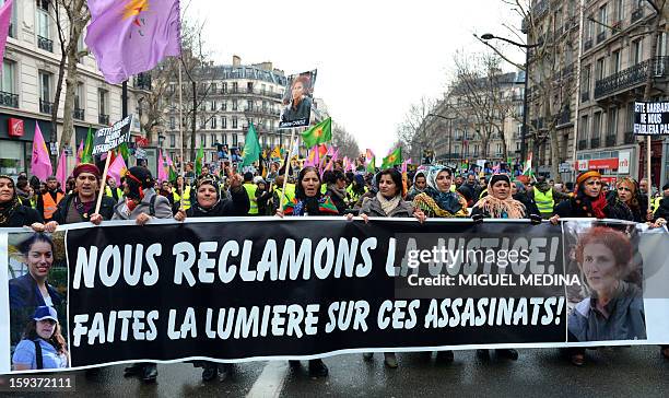 Hundreds of people of Kurdish origin take part in a demonstration on January 12, 2013 in Paris, two days after three Kurdish women were found shot...