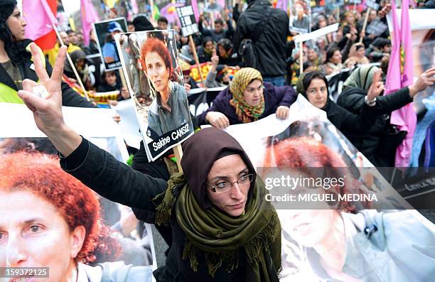 Hundreds of people of Kurdish origin take part in a demonstration on January 12, 2013 in Paris, two days after three Kurdish women were found shot...