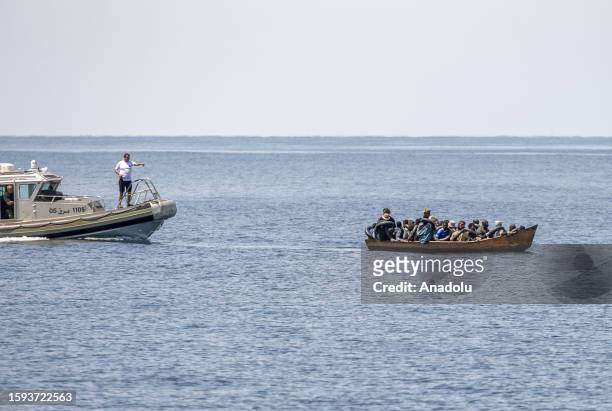 Irregular migrants are seen as an operation is carried out by coastguards teams of the Tunisian National Guard against the migrants who want to reach...