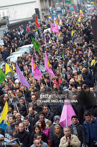 Hundreds of people of Kurdish origin take part in a demonstration on January 12, 2013 in Paris, two days after three Kurdish activits were found shot...