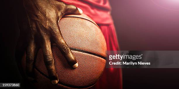 basketball grip - young man holding basketball stockfoto's en -beelden