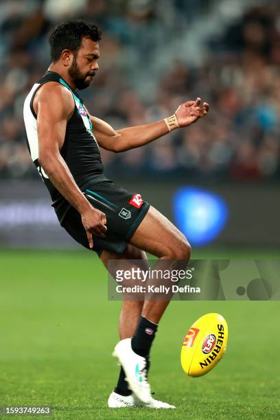 Willie Rioli of the Power kicks a goal during the round 21 AFL match between Geelong Cats and Port Adelaide Power at GMHBA Stadium, on August 05 in...