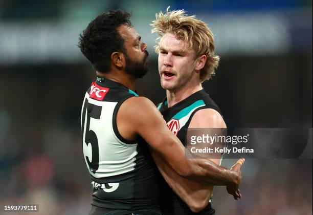 Jason Horne-Francis of the Power celebrates kicking a goal with Willie Rioli of the Power during the round 21 AFL match between Geelong Cats and Port...