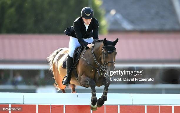 Dublin , Ireland - 12 August 2023; Robbie Healy of Ireland competes on Kms Clintland during the Defender Puissance during the 2023 Longines FEI...