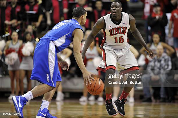 Anthony Bennett of the UNLV Rebels guards against DeLovell Earls of the Air Force Falcons at the Thomas & Mack Center on January 12, 2013 in Las...