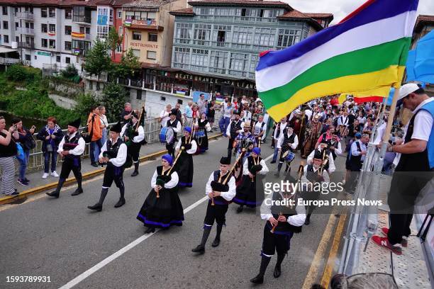 Several people in traditional costumes during the reading of the proclamation for the start of the 85th edition of the International Descent of the...