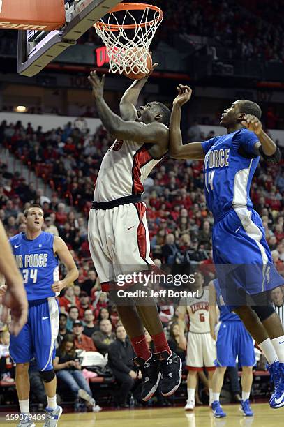 Anthony Bennett of the UNLV Rebels drives to the basket against Michael Lyons of the Air Force Falcons at the Thomas & Mack Center on January 12,...