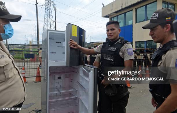 Police officers shows a fridge confiscated during a joint operation between the Police and the Armed Forces at the Zonal Penitentiary No 8 in...