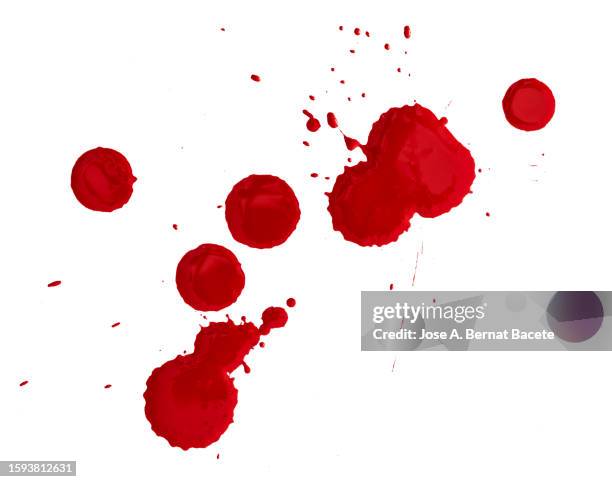 full frame of drops and splashes of red paint on a white canvas. - sang photos et images de collection