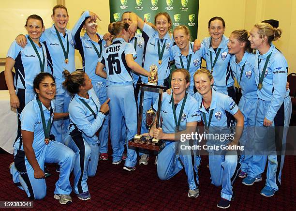 The Breakers pose with the trophy winning the WNCL Final match between the NSW Breakers and the Queensland Fire at the Sydney Cricket Ground on...