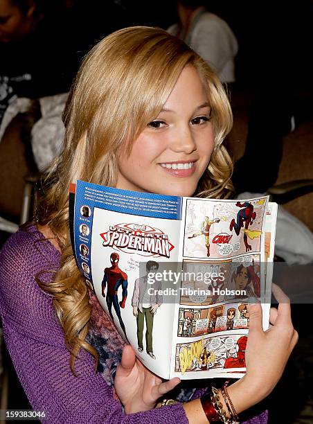 Actress Olivia Holt reads to a group of children at the "Reading With: Marvel Comics Close-Up" kick-off event at the Burbank Public Library on...