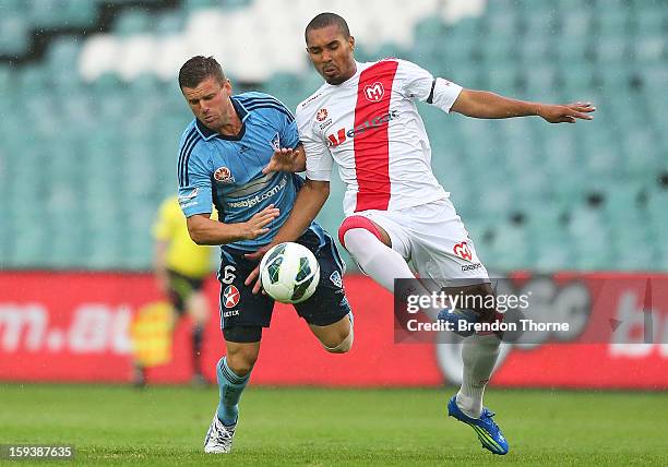 Jason Culina of Sydney competes with Patrick Gerhardt of the Heart during the round 16 A-League match between Sydney FC and the Melbourne Heart at...